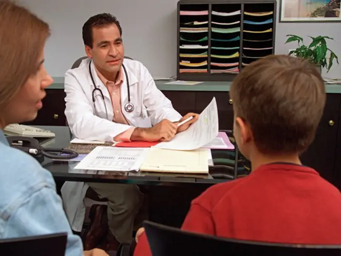 Mother and Son Discuss Options with Pediatrician