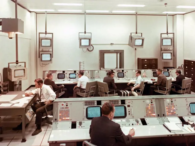 A view taken inside the staff support room (SSR), a support room for the MOCR (Mission Operations Control Room) used for scheduling, monitoring and directing network activities and readiness checks.  Responsibilities also include verifying remote site prepass equipment and directing network handover operations.