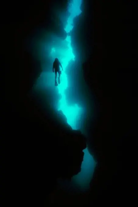 Diver Silhouetted in Grottoes