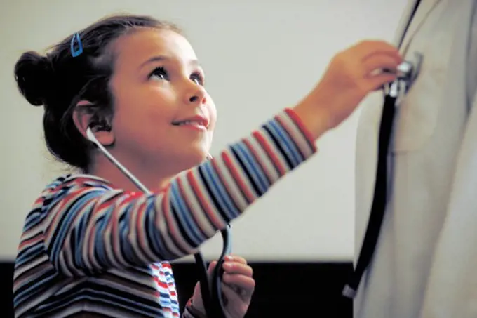 Child Listens to Doctor's Heartbeat