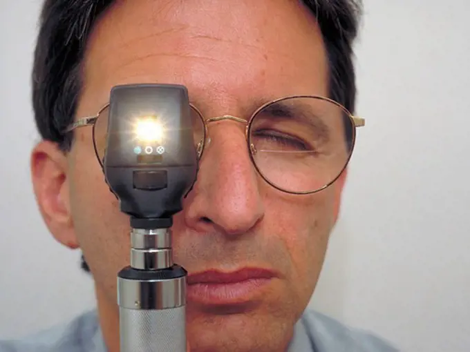 Ophthalmologist Peers Through Ophthalmoscope