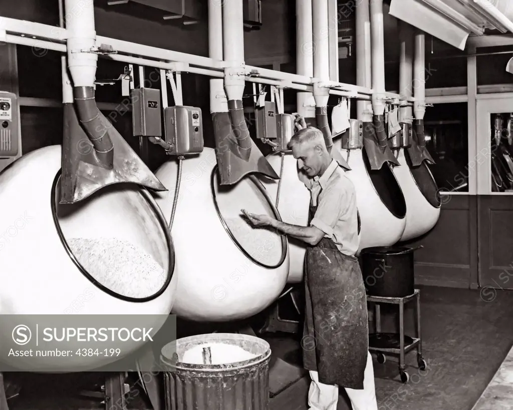 This historical CDC image, from the National Institute for Occupational Safety and Health (NIOSH), depicted a manufacturing technician inside a Norwich, New York pharmaceutical pill factory.