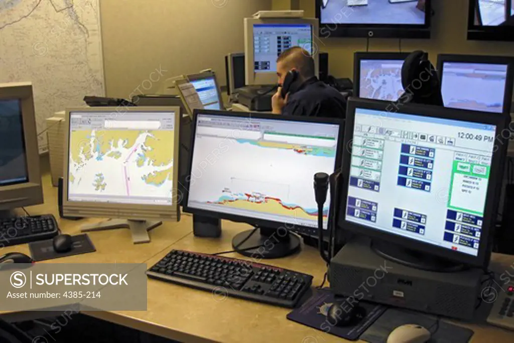 A man stands the vessel traffic center watch at Marine Safety Unit Valdez. The watch is manned 24 hours a day, seven days a week. The center tracks the movements of vessels in and out of Valdez and through the vessel traffic lanes in Prince William Sound as well as ice calving from the nearby glacier. (Coast Guard photo/MSU Valdez)