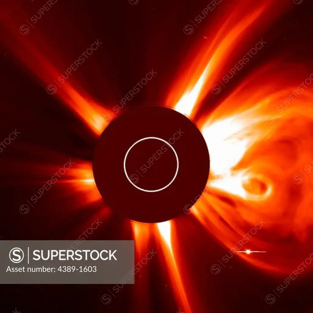 The Large Angle and Spectrometric Coronagraph (LASCO) cameras of the Solar and Heliospheric Observatory (SOHO) satellite captured this image of a solar coronal mass ejection, a wave of electrons and protons, and a small amount of heavier element, streaming from the solar corona.