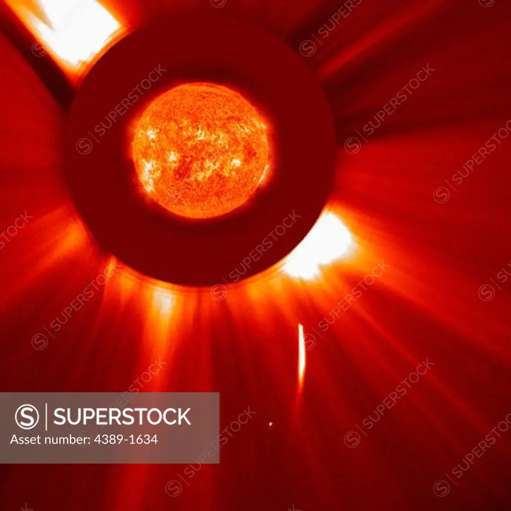 A pair of comets belonging to the Kreutz family of sun grazing comets (lower middle) seen by Large Angle and Spectrometric Coronagraph  (LASCO) C2 camera of the Solar and Heliospheric Observatory (SOHO). The Sun's corona is visible, as is the Sun, superimposed on the occulting disc.