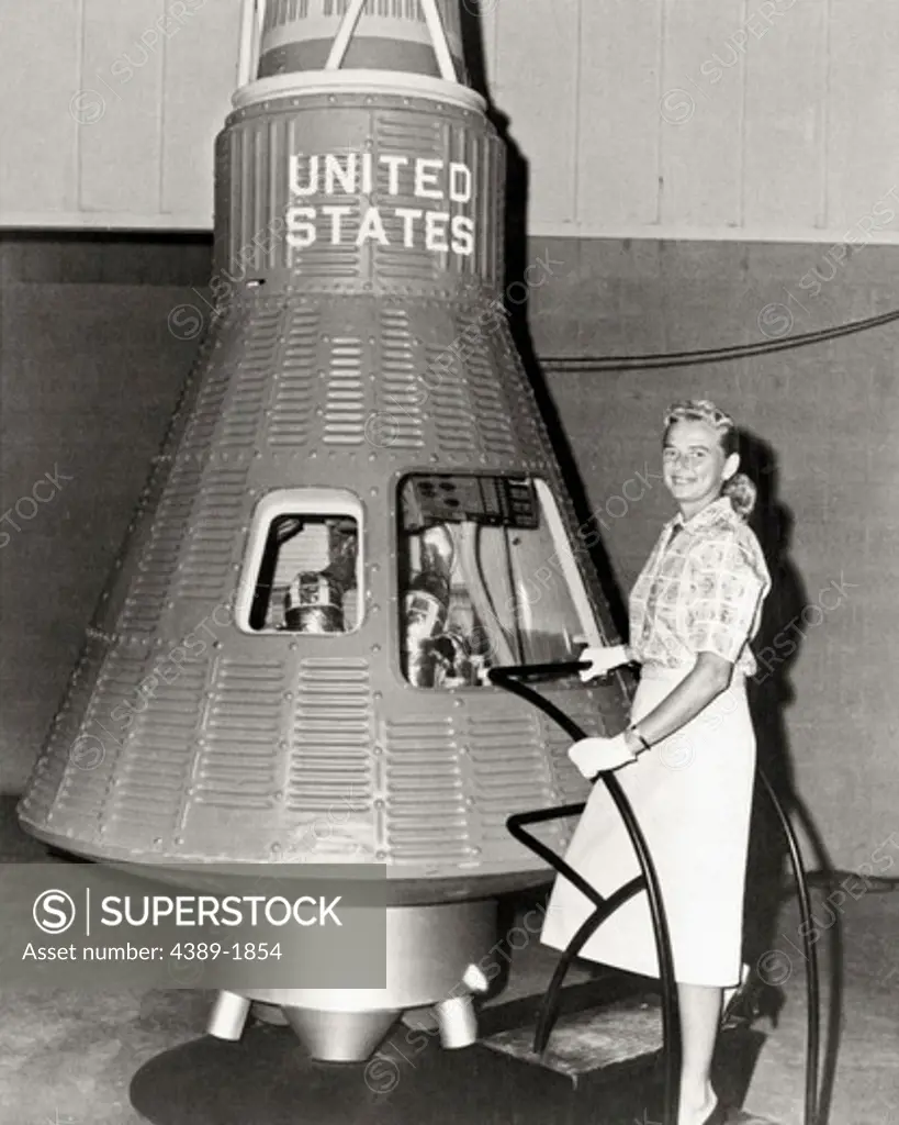 Jerrie Cobb Poses Beside Mercury Capsule