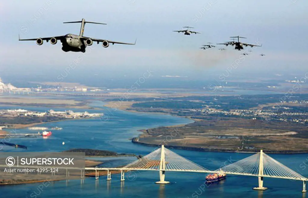 Fifteen C-17 Globemaster IIIs from Charleston Air Force Base, S.C., fly over the city of Charleston's Arthur J. Ravenel Bridge Dec. 20 during a training exercise.  (U.S. Air Force photo/Staff Sgt. James L. Harper Jr.)