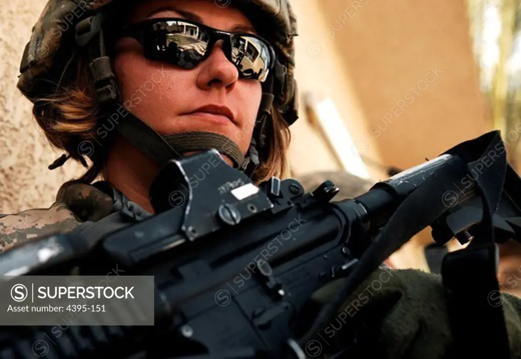 U.S. Army Spc. Rebecca Buck, a medic from Headquarters and Headquarters Company, 1st Battalion, 14th Infantry Regiment, 2nd Stryker Brigade Combat Team, 25th Infantry Division, provides perimeter security outside an Iraqi police station in the Tarmiya Province of Iraq, March 30, 2008.  (U.S. Air Force photo by Tech. Sgt. William Greer) (Released)