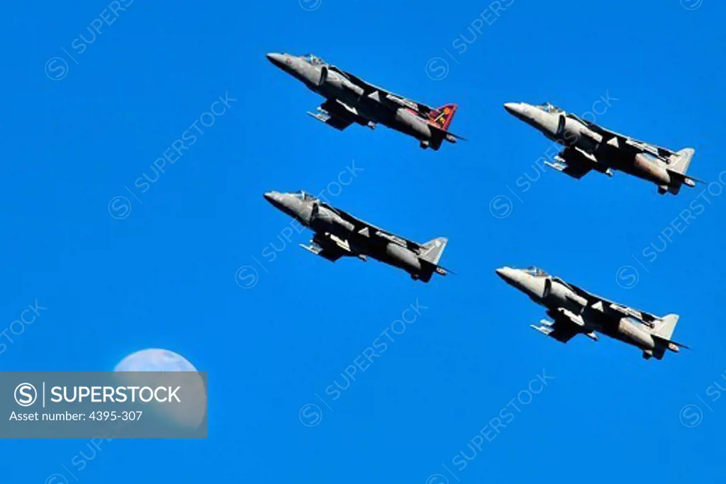 110212-N-ZS026-188 SAN DIEGO (Feb. 12, 2011) AV-8B Harriers fly by the moon over San Diego Bay during the Centennial of Naval Aviation Open House and Parade of Flight at Naval Air Station North Island.