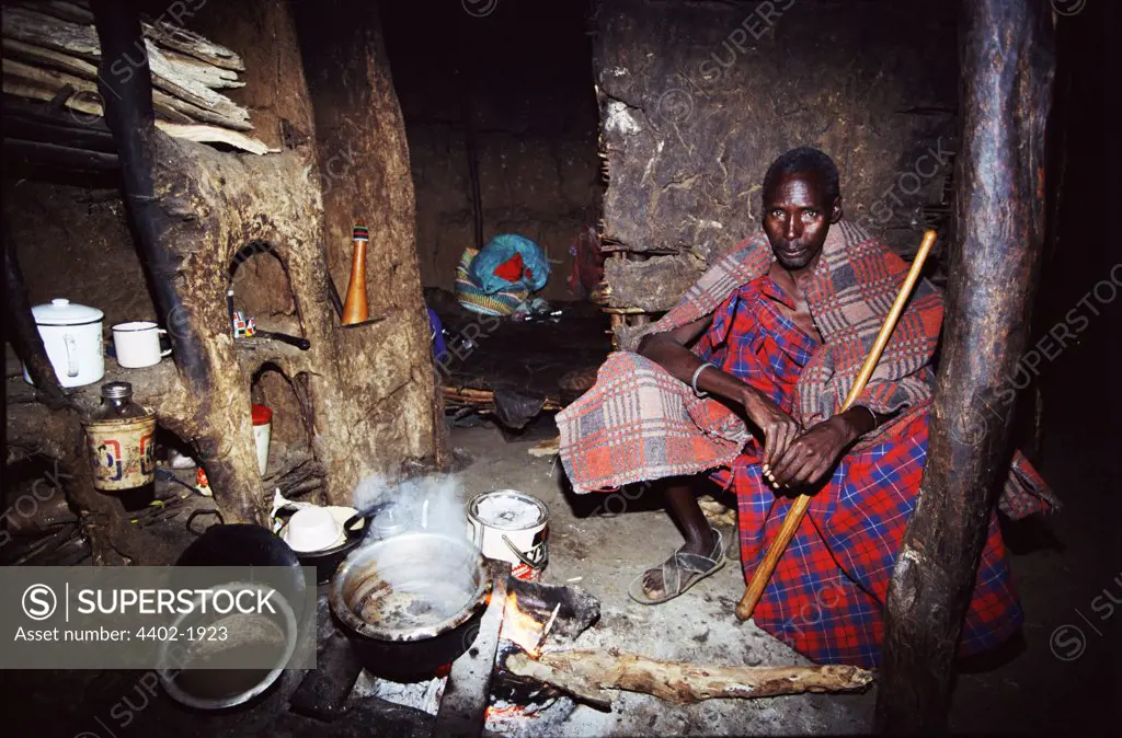 Maasai man in traditional house, Kenya