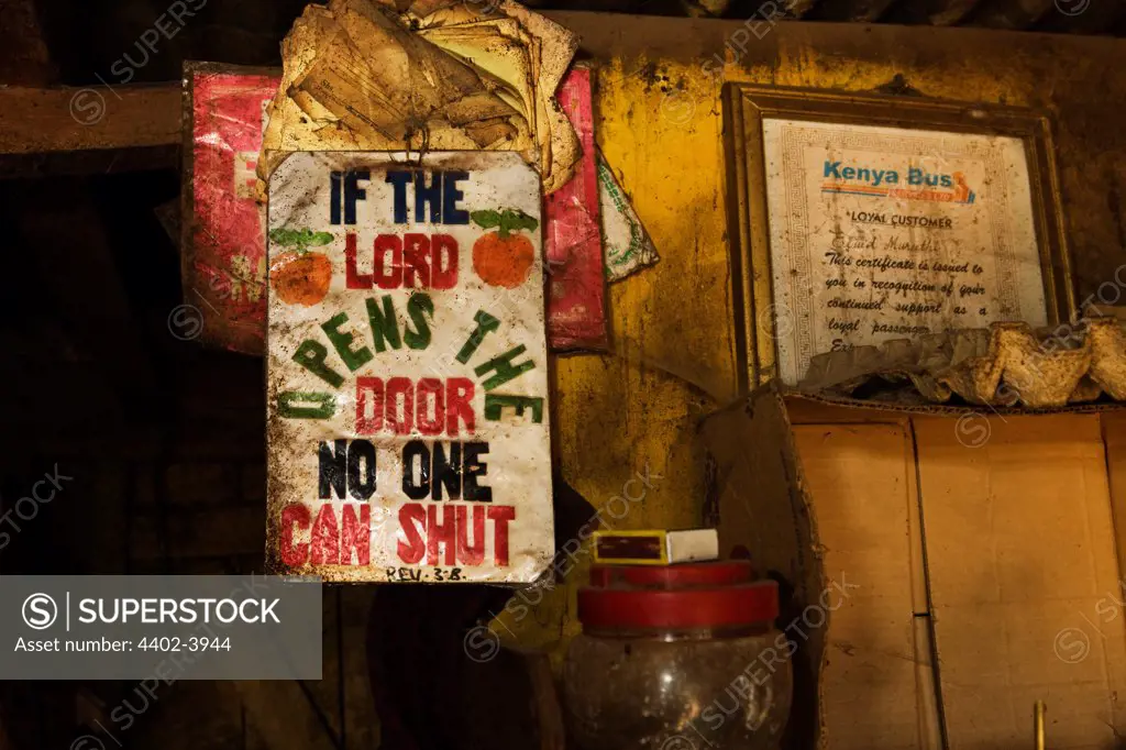 Sign hanging in interior of the Half-London greengrocer, Nairobi, Kenya.