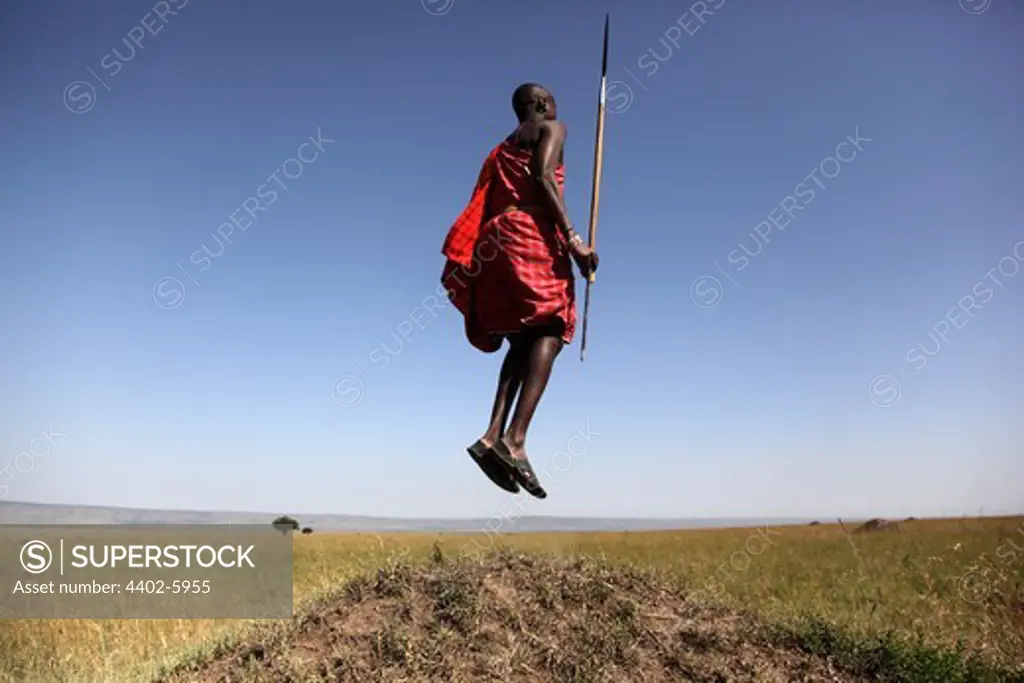 Masai guard jumping, Masai Mara, Kenya