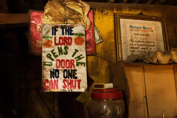 Sign hanging in interior of the Half-London greengrocer, Nairobi, Kenya.