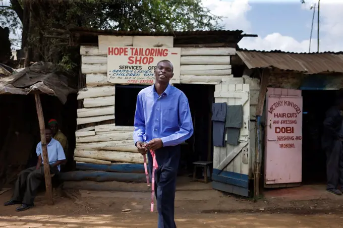 Jared Duma outside the Hope Tailoring Shop, Nairobi, Kenya.