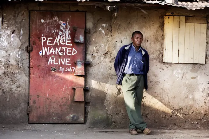 Shop door with slogan 'Peace wanted alive', Nairobi, Kenya.