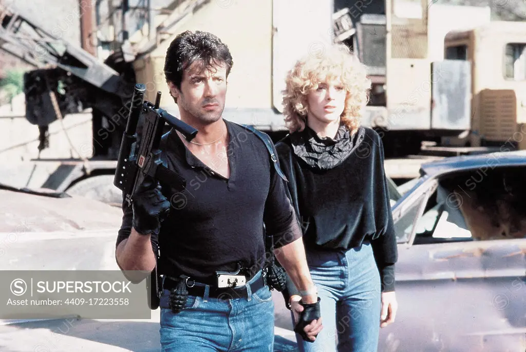 SYLVESTER STALLONE and BRIGITTE NIELSEN in COBRA (1986), directed by GEORGE P. COSMATOS.