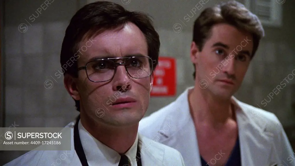 JEFFREY COMBS and BRUCE ABBOTT in RE-ANIMATOR (1985), directed by STUART GORDON.