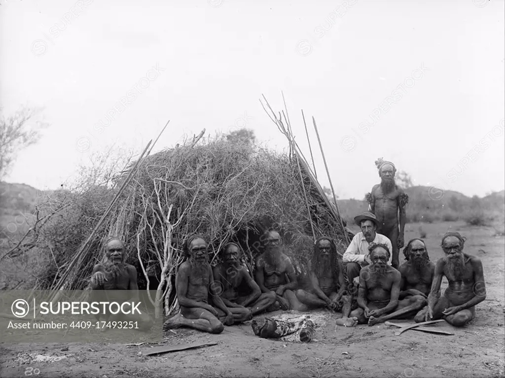 Baldwin Spencer seated with the Arrernte elders, Alice Springs, Central Australia, 1896. Date/Period: 1896. Image. Glass plate negative Glass plate negative. Height: 160 mm (6.29 in); Width: 210 mm (8.26 in). Author: Walter Baldwin Spencer and Francis J Gillen.