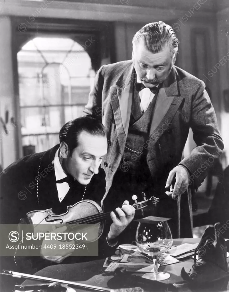 BASIL RATHBONE and NIGEL BRUCE in THE ADVENTURES OF SHERLOCK