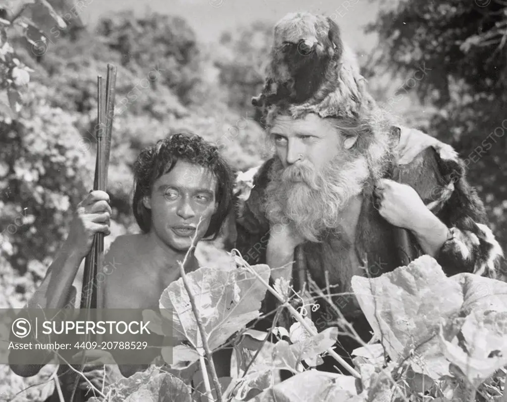 DAN O'HERLIHY and JAIME FERNANDEZ in THE ADVENTURES OF ROBINSON CRUSOE (1954) -Original title: ROBINSON CRUSOE-, directed by LUIS BUÑUEL.