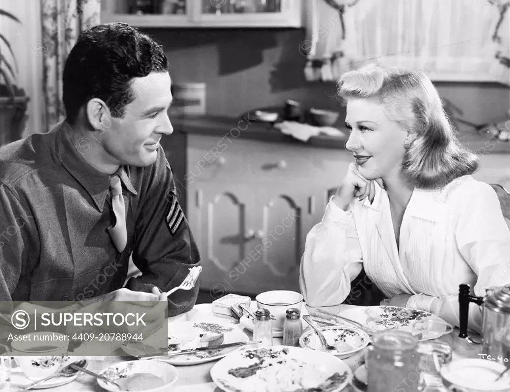 GINGER ROGERS and ROBERT RYAN in TENDER COMRADE (1943), directed by EDWARD DMYTRYK.