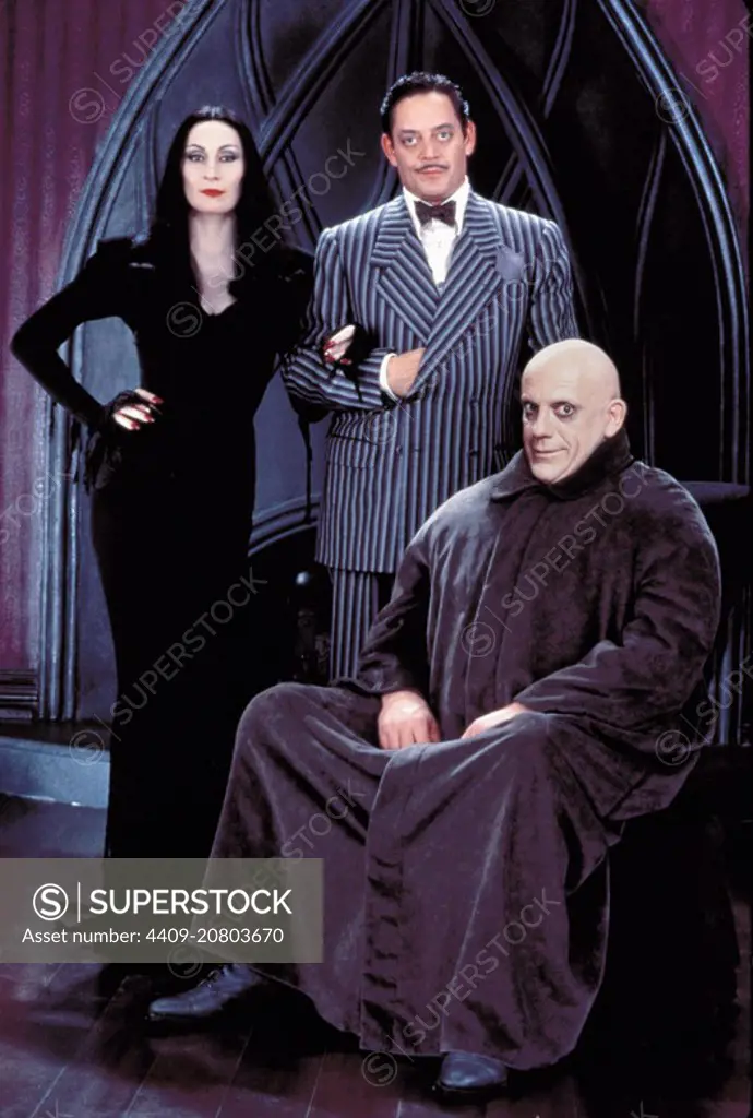 CHRISTOPHER LLOYD, ANJELICA HUSTON and RAUL JULIA in THE ADDAMS FAMILY (1991), directed by BARRY SONNENFELD.