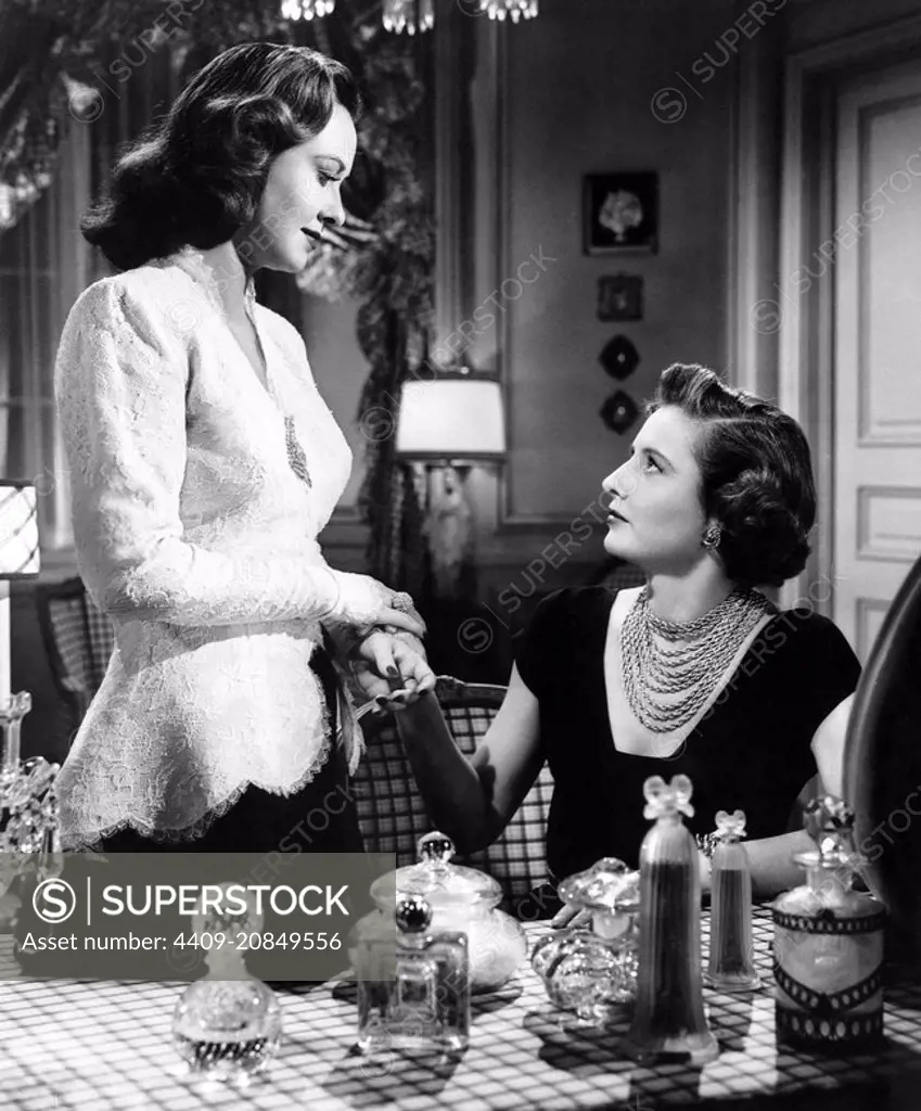 BARBARA STANWYCK and MARGARET LINDSAY in B. F. 'S DAUGHTER (1948), directed by ROBERT Z. LEONARD.