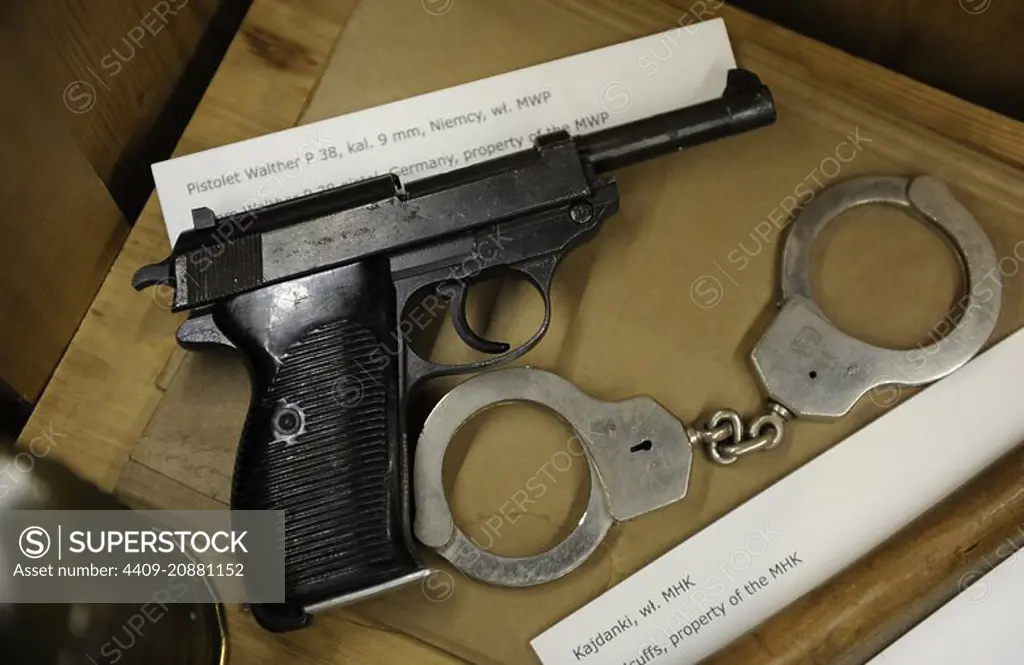 Poland. Krakow. Gestapo Museum. Handcuffs and Walther P38, 9mm semi-automatic pistol.