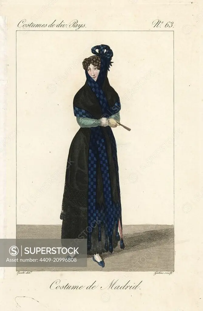 Woman of Madrid, Spain, 19th century. She wears the traditional black mantilla veil trimmed with blue check and tassels, black basquina dress, and carries a fan. Handcoloured copperplate engraving by Georges Jacques Gatine after an illustration by Louis Marie Lante from Costumes of Various Countries, Costumes de Divers Pays, Paris, 1827.