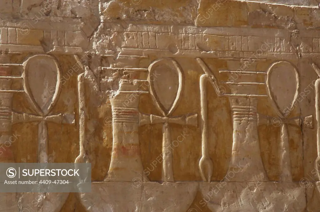 Reliefs depicting the ankh, uady, scepter linked to power and wealth and djed pillar, symbol of stability. Temple of Hatshepsut. Temples of Deir el-Bahari. Dynasty XVIII. New Kingdom. Egypt.