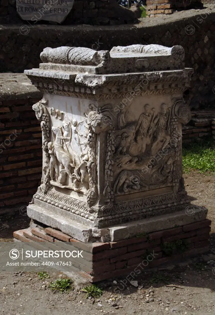 Ostia Antica. Sacellum. Altar of the Twins. Reliefs depicting Cupid carrying the chariot of Mars (left) and Romulus and Remus suckled by the she-wolf discovered by shepherds (right). Italy.