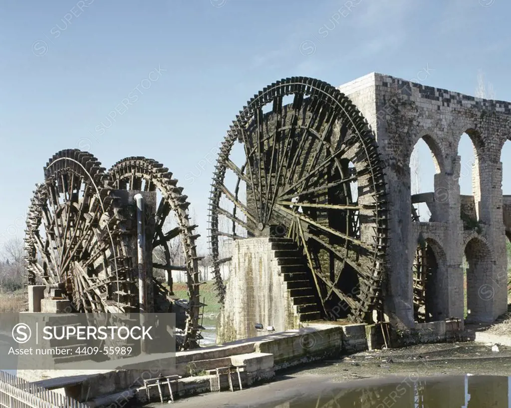 Syrian. The Norias of Bechriyyat in Hama. The waterwheels at Hama, known as Norias, are up to 20m high and have been standing since the 13th century. Middle East.