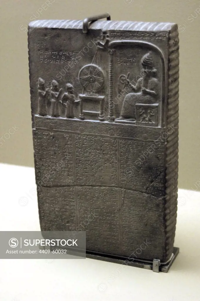 The Sun God Tablet. Limestone. The scene carved in the relief represents Nabu-aplu-iddina being led by the priest Nabu-nadin-shum and the goddess Aa into the presence of the Sun-god, woh is seated within Ebabbara. Before the god is the solar disc. Middle Babylonian. Neo-Babylonian Dynasty. 860 BC-850 BC. Sippar, Iraq, Middle East. British Museum. London, England, United Kingdom.