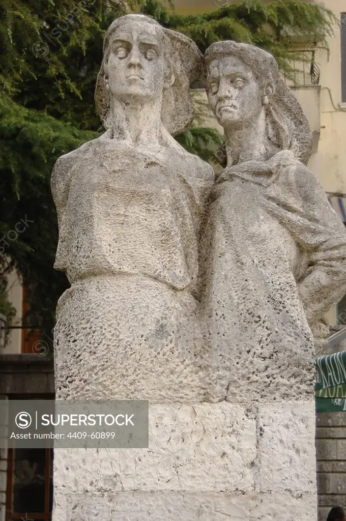 Anonymous. Hanged Woman. White stone statue of two women hanged by the nazis during the World War II on suspicion of helping the nationalists against the invaders. It represents Bule Naipi and Persefoni Koke_dhima, executed by the German Nazis in 1944. Sheshi Cerciz Topulli Square. Gjirokaster. Albania.