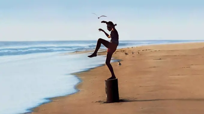 RALPH MACCHIO in THE KARATE KID (1984), directed by JOHN G. AVILDSEN.