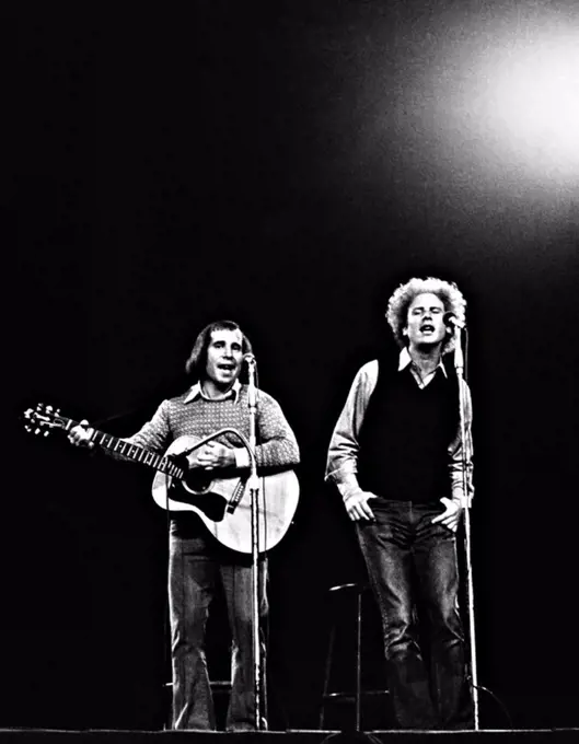 Art Garfunkel and Paul Simon perform at a "Together w/McGovern" concert for the Presidential candidate. Madison Square Garden, New York, 1972. PAUL SIMON. ART GARFUNKEL. SIMON & GARFUNKEL.