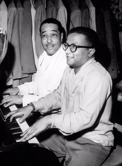 American jazz musicians Duke Ellington and Billy Strayhorn play the piano together. 1948.