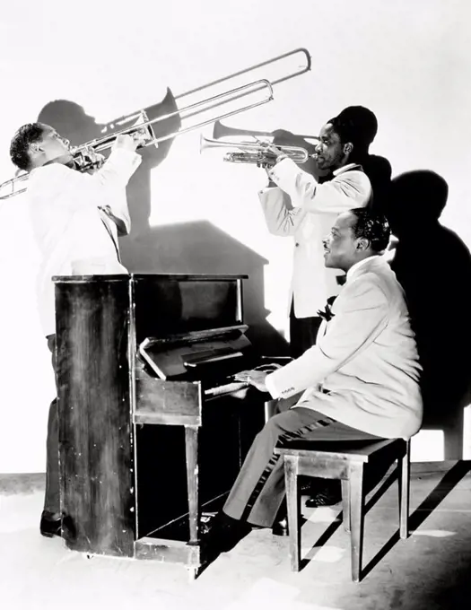 Count Basie at piano and two members of his band in "Hit Parade of 1943".