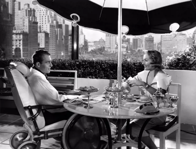 RALPH BELLAMY and CAROLE LOMBARD in HANDS ACROSS THE TABLE (1935), directed by MITCHELL LEISEN.