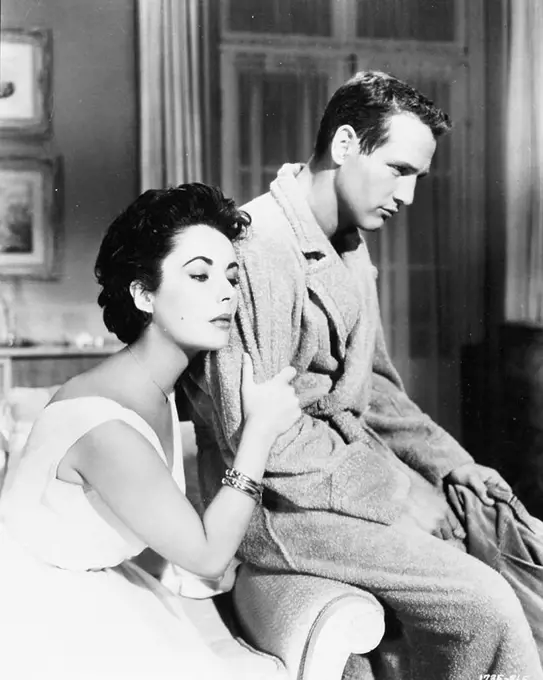 PAUL NEWMAN and ELIZABETH TAYLOR in CAT ON A HOT TIN ROOF (1958), directed by RICHARD BROOKS.