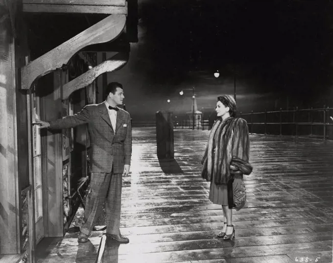 JACK CARSON and JOAN CRAWFORD in MILDRED PIERCE (1945), directed by MICHAEL CURTIZ.