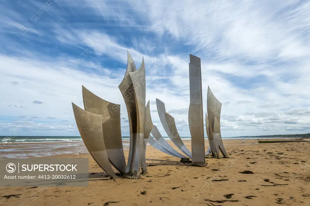 Les Braves de Saint-Laurent-sur-Mer monument. Erected on the sand of Omaha Beach, in homage to the 35,000 allied soldiers who landed there on 6 June 1944, and to the 3,000 victims, dead, missing and wounded on the evening of D-Day, the "Les Braves" monument, the work of the sculptor Anilore Banon, whose steel sails stand at the foot of the steps of the Signal monument in Saint-Laurent-sur-Mer, was inaugurated on 5 June 2004, on the eve of the 60th anniversary of the Normandy landings. Calvados, Normandy, France