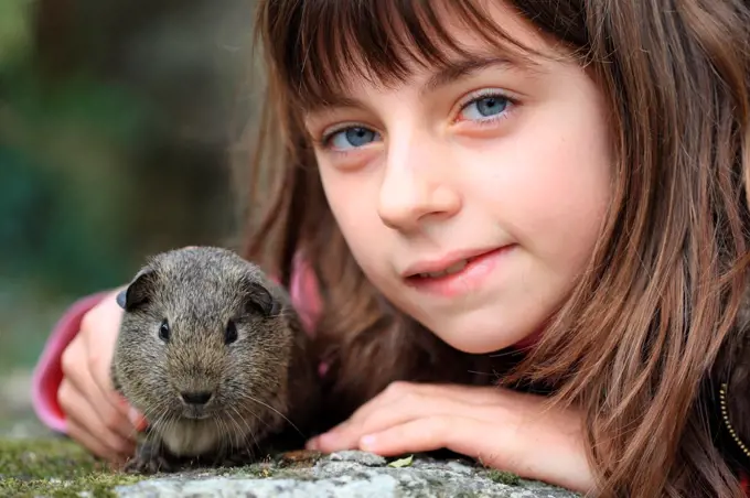 Girl with a Guinea pig France