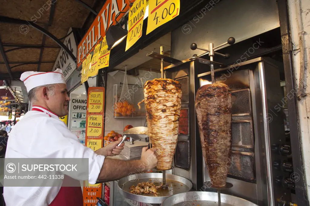 Man cooking kebab in a restaurant, Istanbul, Turkey