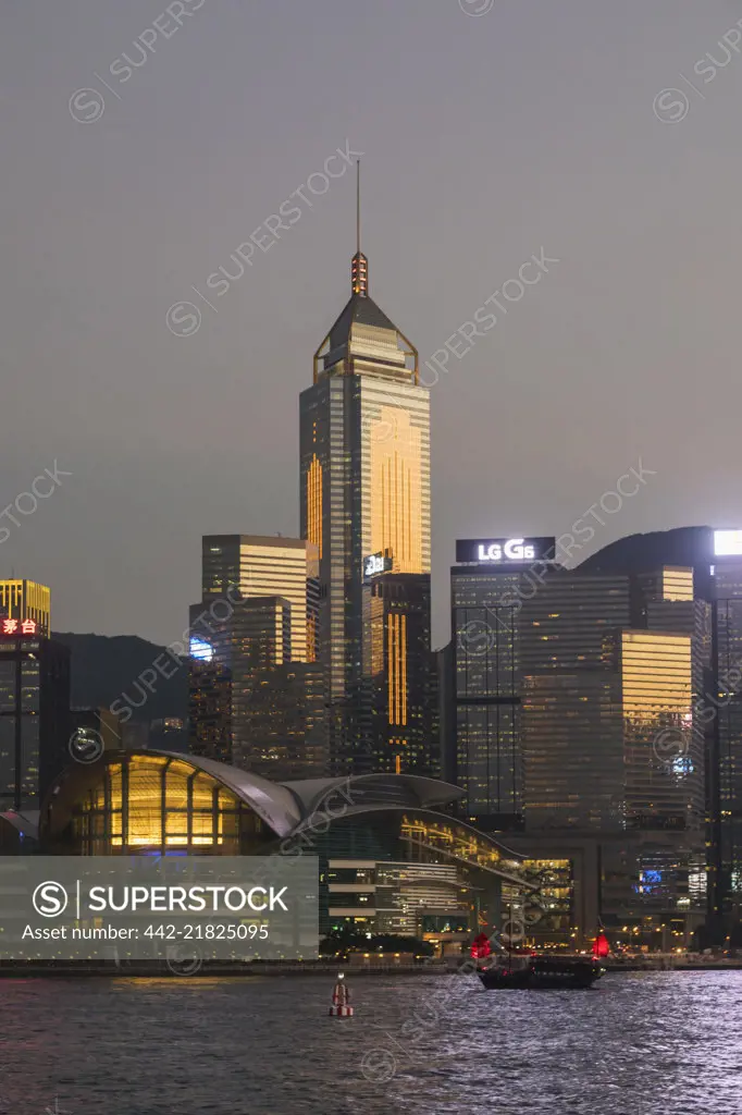 China, Hong Kong, Junk and City Skyline