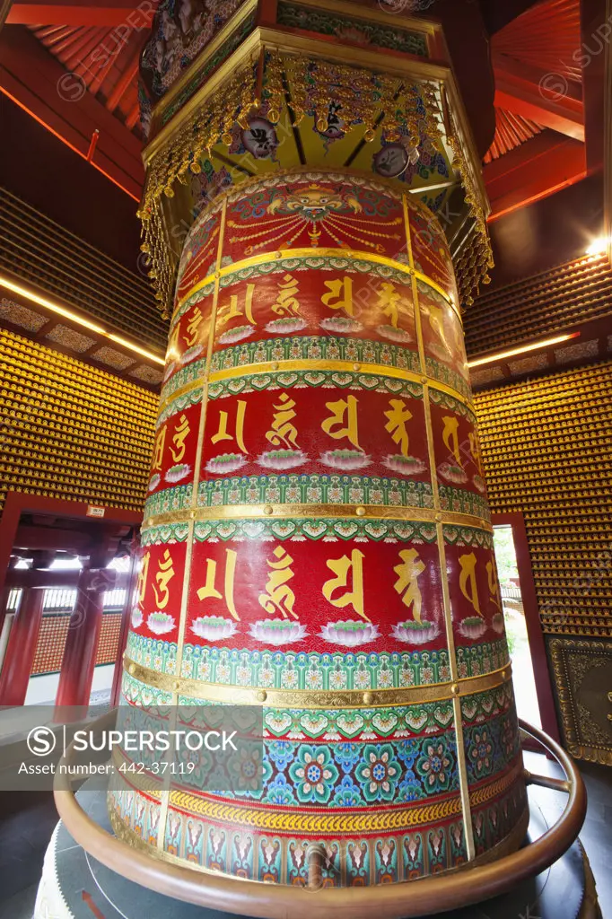 Vairocana Buddha Prayer Wheel in a temple, Buddha Tooth Relic Temple And Museum, Chinatown, Singapore