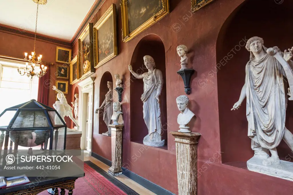 Statues and paintings in an art gallery, Petworth House, Petworth, West Sussex, England