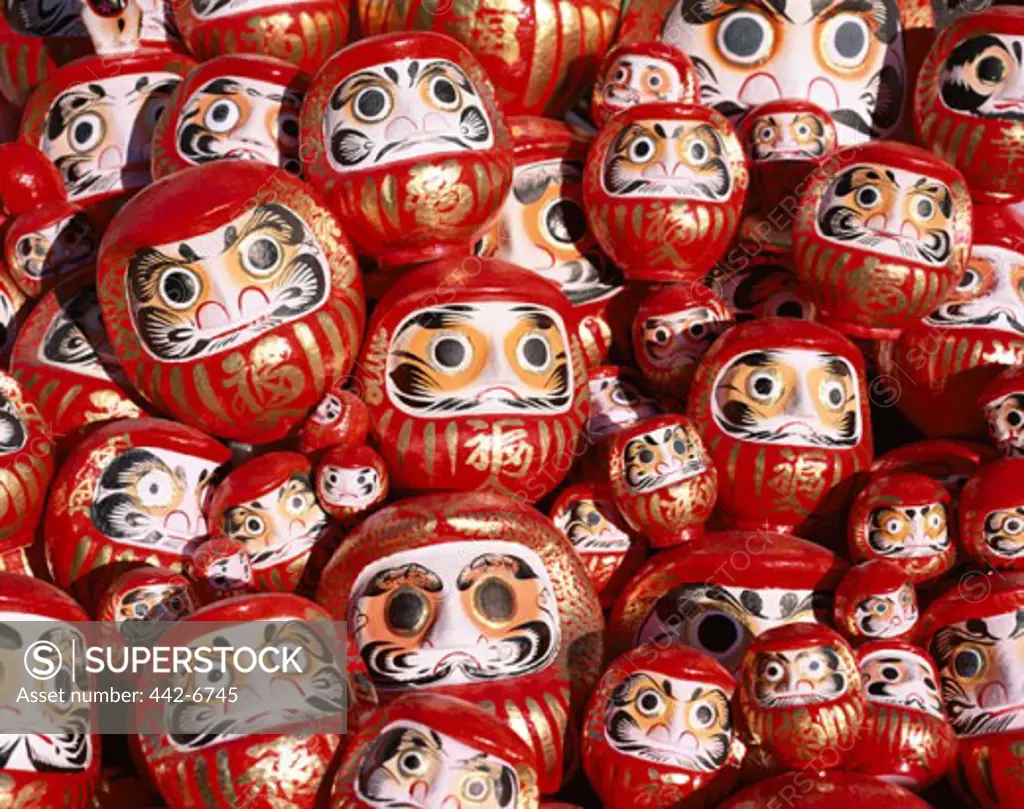 Close-up of Daruma dolls at a New Year festival, Tokyo, Honshu, Japan