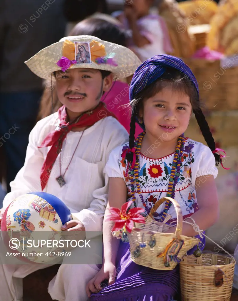 Portrait of a girl and boy dressed in traditional costumes, Oaxaca ...