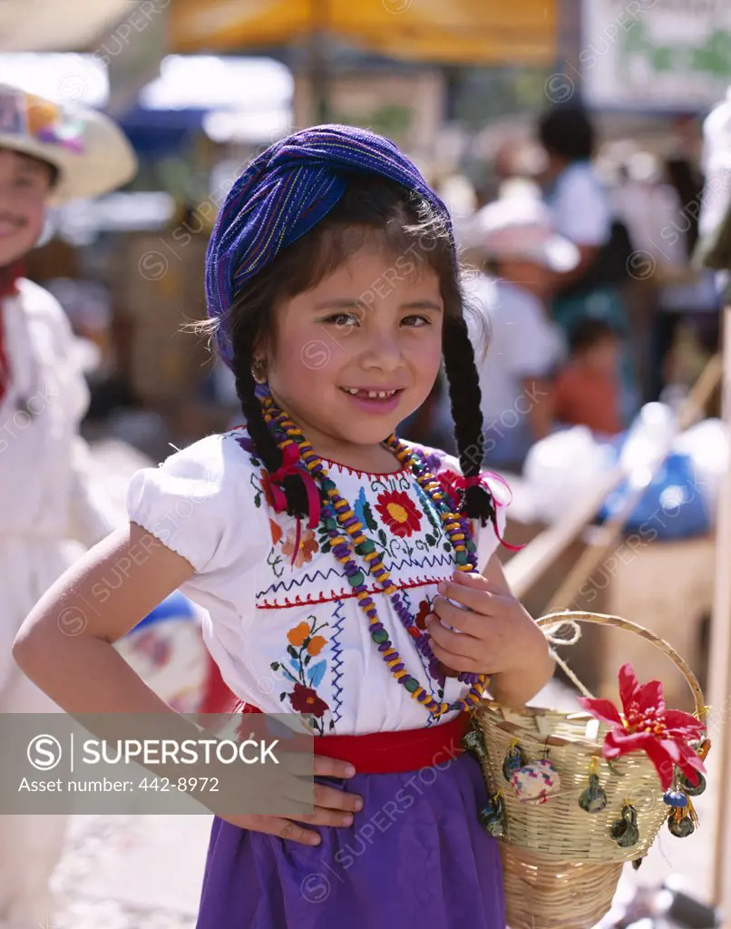 Portrait of a girl dressed in a traditional costume, Oaxaca, Mexico